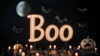 Illuminated marquee BOO sign with glowing lights surrounded by flying bats, pumpkins and candles against dark background creates spooky Halloween atmosphere.