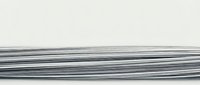 Bundle of thin metallic wires or cables arranged horizontally against white background, industrial materials for electrical engineering and construction projects.