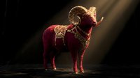 Majestic ram with golden ornate decorative patterns standing in dramatic lighting against dark background for luxury branding and mystical themed projects.