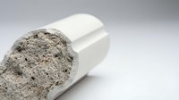 Protein powder supplement spilling from white container on clean background for fitness nutrition and bodybuilding lifestyle concepts.