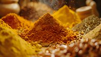 Vibrant piles of aromatic ground spices including turmeric, paprika, and cumin powder with selective focus on warm golden and reddish hues in rustic setting.