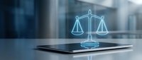 Glowing scales of justice hologram emerging from smartphone on desk with blurred office background, representing legal technology and digital law services.