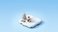 Snowman wearing red hat sitting beside decorated evergreen tree on snowy cloud-shaped platform against light blue background, winter holiday seasonal decoration.