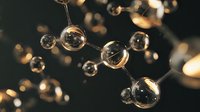 Glowing molecular structure with connected spheres on dark background creating scientific chemistry concept for educational materials and research presentations.