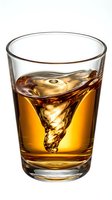 Glass of whiskey with ice cubes on white background, isolated for beverage, alcohol, and drink design projects.