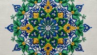 Intricate mandala design with blue and green floral patterns, golden accents on textured background for meditation, yoga studios, spiritual decor.