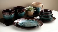 Elegant ceramic dinnerware set with turquoise and brown glazed finish displayed on white surface. Modern tableware collection for dining and kitchen decor.