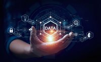 Businessman hand holding glowing data shield with network connections and digital technology icons on dark blue background for cybersecurity concepts.