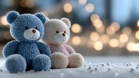 Soft plush teddy bears, blue and pink, sitting together against blurred bokeh lights background creating romantic mood for Valentine's day or baby announcement.