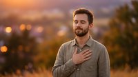 Man with hand on chest standing outdoors at sunset with city lights in blurred background. Caucasian male wearing casual button-up shirt expressing gratitude, sincerity, or pledge. Golden hour portrait for lifestyle, emotion, and inspirational content.