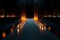 Mystical pathway illuminated by glowing candles along water reflection at night, creating dramatic atmosphere with architectural columns and ambient lighting.