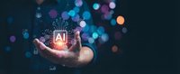 Hand holding glowing AI chip with circuit patterns and digital icons floating above palm against dark bokeh background for technology concepts.