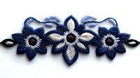 Navy blue and white floral embroidery patch with three decorative flowers and leaves on white background, isolated for crafting and fashion design projects.