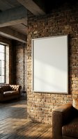 Empty white frame on exposed brick wall in industrial loft interior with leather furniture and wooden floors for artwork display mockup.