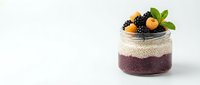 Healthy chia pudding parfait with fresh blackberries and physalis in glass jar on white background, nutritious breakfast dessert for wellness lifestyle.