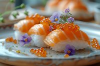 Fresh salmon nigiri sushi garnished with red caviar and purple edible flowers on ceramic plate, selective focus capturing gourmet Japanese cuisine presentation.