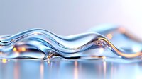 Flowing liquid wave with blue and orange light reflections creates dynamic abstract composition against blurred background for modern design projects.