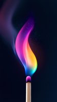 Burning match with vibrant rainbow colored flame against dark background, magical glowing smoke effect with sparkles and gradient colors from blue to pink and yellow.