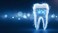 Digital tooth hologram with glowing particles and network connections on blue background for dental technology and healthcare innovation concepts.