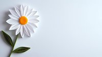 Paper craft white daisy flower with green leaves on light background, minimalist floral composition with copy space for text or design elements.