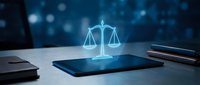 Digital justice scales hologram emerging from tablet screen with legal documents and gavel on desk representing modern law technology and legal services.