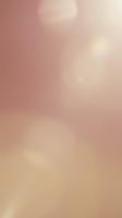 Soft gradient background transitioning from dusty rose to warm beige with subtle bokeh light effects, suitable for overlays, web design, and creative projects.