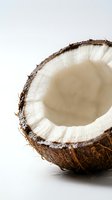 Fresh coconut half showing white meat and natural brown shell on clean white background for healthy cooking and tropical food concepts.