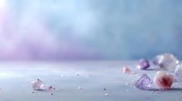 Delicate pink and purple crystals scattered on misty surface against dreamy pastel background, creating ethereal minimalist composition for wellness and spirituality designs.