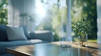 Tranquil morning sunlight streams through window, illuminating glass of water and small plant on wooden table in minimalist living room with blue sofa.