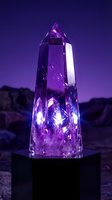 Large purple amethyst crystal tower glowing with inner light on black pedestal against twilight mountain landscape for spiritual healing meditation decor.
