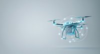 Futuristic drone with glowing blue wireframe design and illuminated elements hovering against neutral background, representing advanced technology and innovation for digital projects.