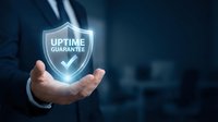 Business professional holding glowing uptime guarantee shield symbol representing reliable service and system availability for corporate presentations.