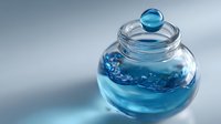 Clear glass jar with blue liquid inside and round glass lid, creating elegant minimalist composition on soft gradient background.