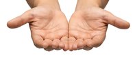 Open cupped hands gesture showing palms up in receiving or offering position isolated on white background for charity donation concepts.