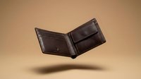 Brown leather wallet floating in mid-air against warm beige background, showcasing craftsmanship and premium quality for luxury accessories marketing.