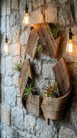 Rustic recycle symbol made of weathered wood with air plants on a stone wall, lit by vintage Edison bulbs, eco-friendly decor concept.