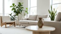 Modern minimalist living room interior with beige sofa, round wooden coffee table, green houseplants and natural light for home decor inspiration.