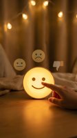 Hand selecting happy smiley face emoticon from neutral and sad options. Glowing mood light with warm ambiance, representing positive emotion, customer satisfaction, feedback rating, mental health and wellbeing.