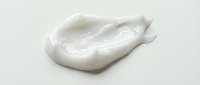Creamy white cosmetic or skincare product sample with smooth, luxurious texture isolated on white background for beauty and wellness design projects.