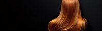Long straight ginger hair flowing smoothly against dark background, showing healthy shine and movement in panoramic composition, suitable for beauty and haircare advertising.