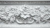Ornate white plaster molding with floral relief pattern featuring roses and decorative scrollwork for interior design and architectural restoration projects.