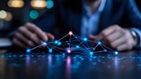 Glowing network connections with blue and pink nodes floating over dark surface while businessman works in background, representing digital transformation and connectivity.
