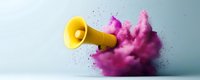 Yellow megaphone with explosive pink cloud burst against light background showcasing dynamic communication and announcement concept for marketing and promotion.