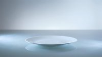Minimalist empty white round platform on reflective surface with soft blue lighting, suitable for product display, cosmetics presentation, and modern design mockups.