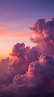 Dramatic purple and pink sunset clouds with vibrant sky colors creating atmospheric weather scene for backgrounds and nature photography projects.