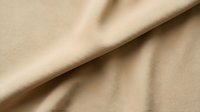 Beige fabric with soft folds and natural texture, suitable for fashion, textile, and design projects.