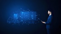 Caucasian businessman in suit managing digital logistics network with glowing truck hologram and connected dots on dark blue background, supply chain concept.