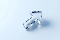 Crystal clear glass arrow pointing upward on light blue background, minimalist design with soft shadow, isolated object for business and presentation concepts.