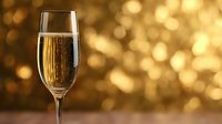 Elegant champagne flute with sparkling wine against golden bokeh background, perfect for celebration themes and festive occasions.