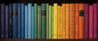 Colorful rainbow arrangement of books on wooden shelf creating vibrant spectrum from blue to red spines for library education and reading concepts.
